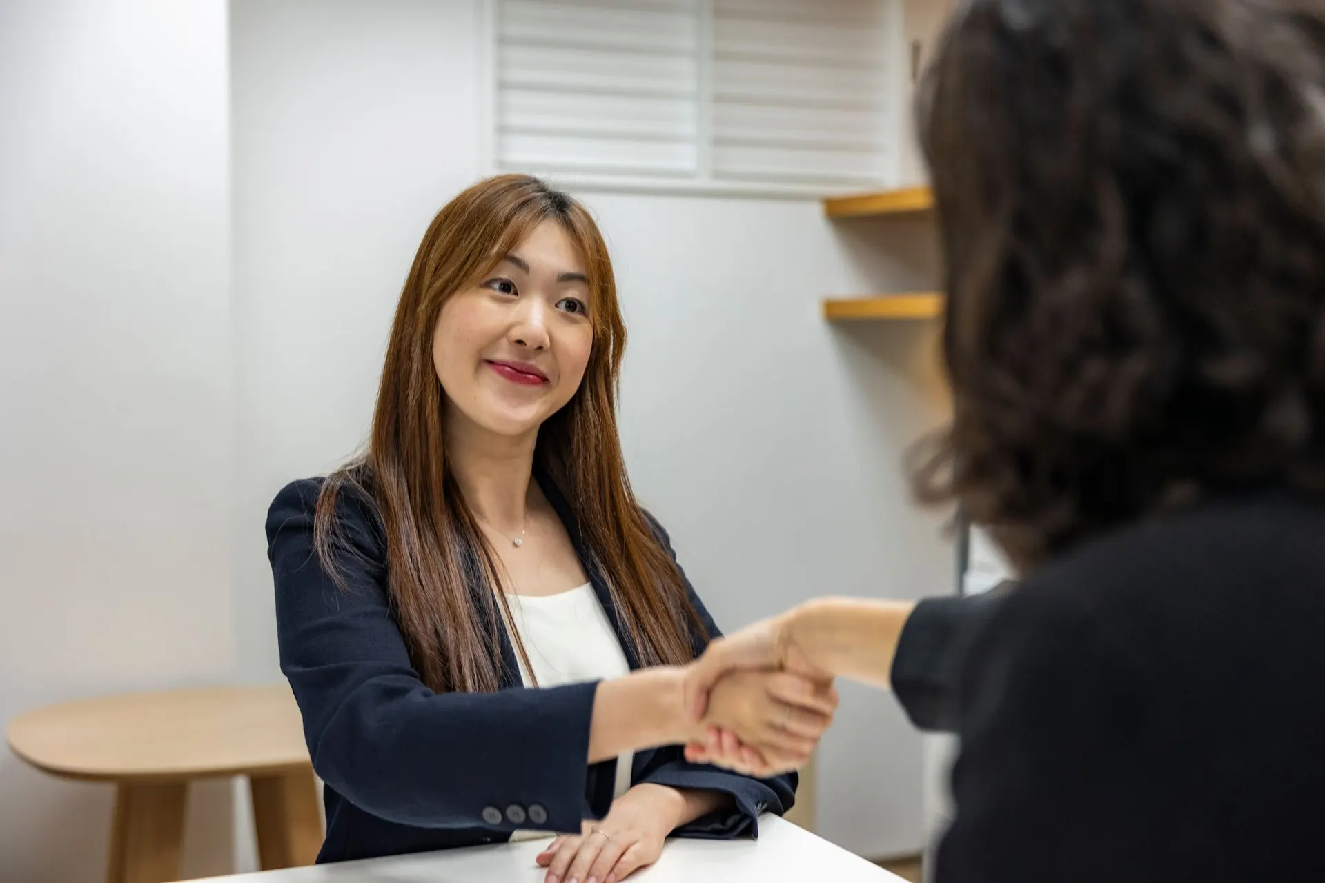 Candidate shaking hands with an interviewer